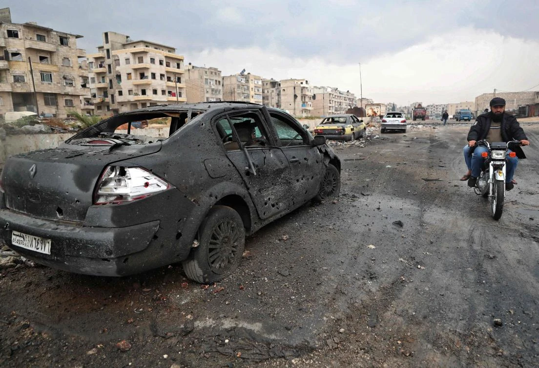 A picture taken on November 4, 2020 shows a burnt car following heavy shelling by Syrian government forces on the industrial area in the rebel-held northwestern Syrian city of Idlib. (AFP)