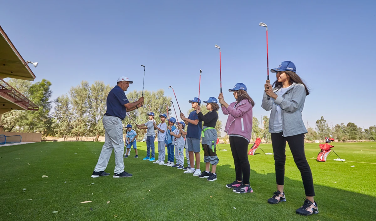 Children participate in a training program that focuses on introducing golf at grassroots level to non-golfing Saudi children.