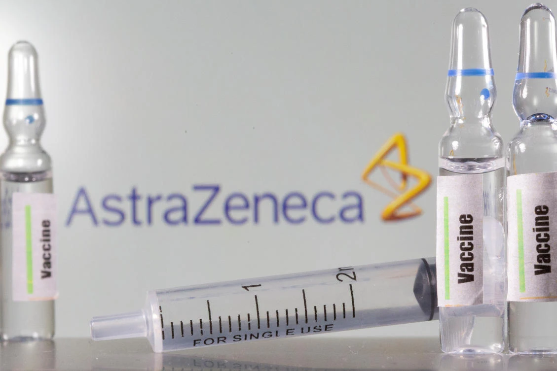 A test tube labelled with the Vaccine is seen in front of AstraZeneca logo in this illustration taken, September 9, 2020. (Reuters)