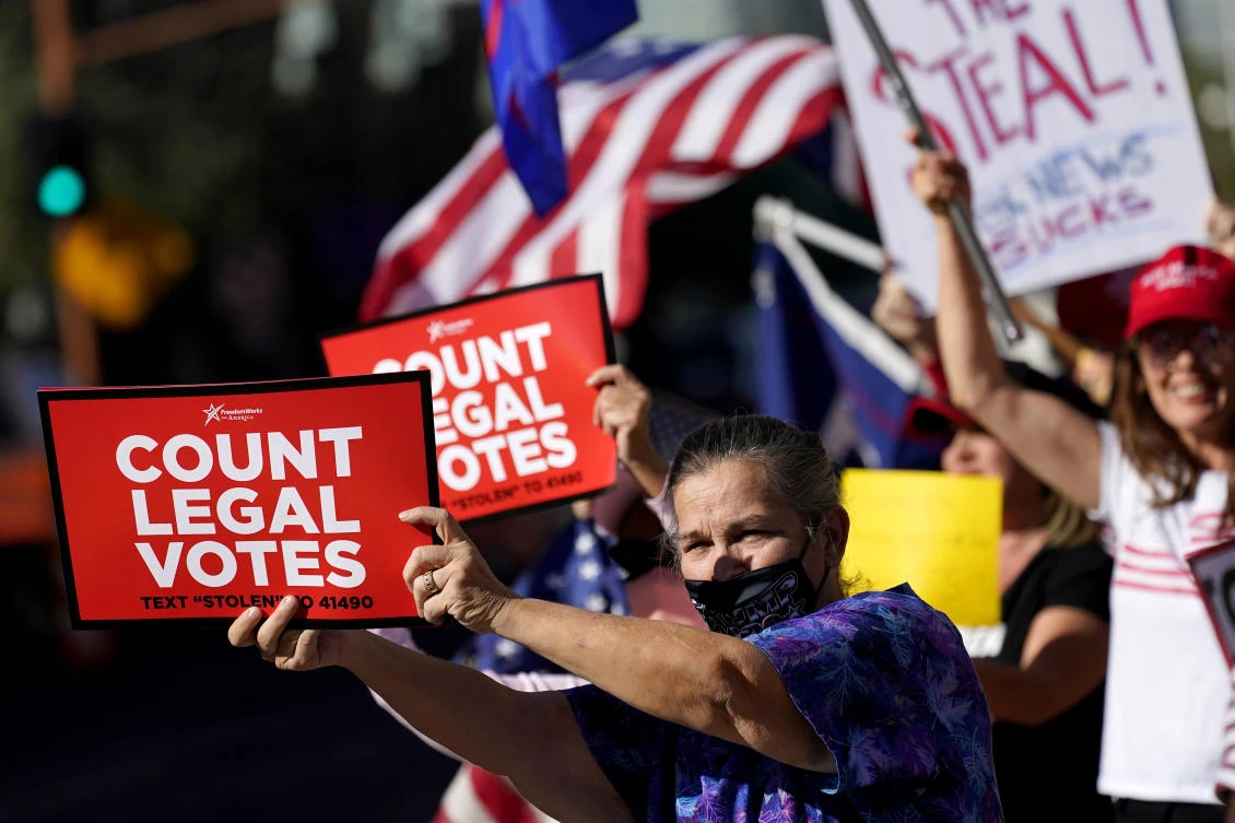 People rally outside City Hall, Thursday in Phoenix. Dozens of pro-Trump protesters gathered to protest after Democratic challenger Joe Biden was reported to have flipped the Republican stronghold of Arizona. (AP)