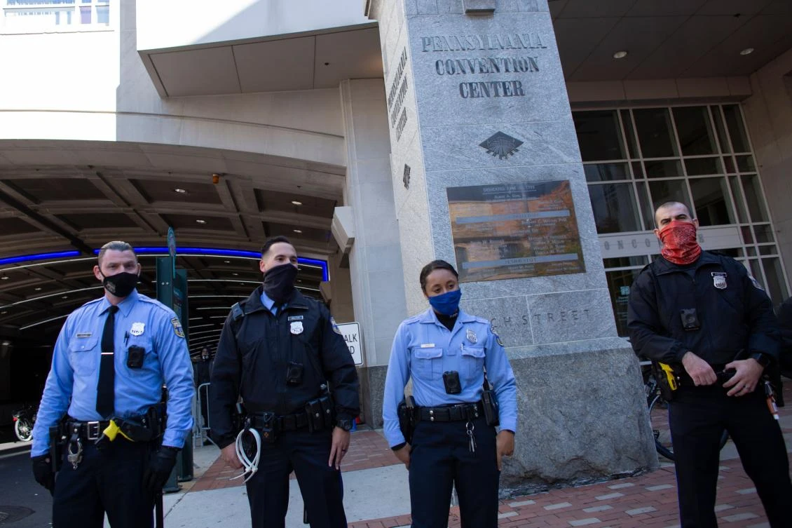Police stand guard outside outside the Pennsylvania Convention Center as protesters demonstrate on November 5, 202 in Philadelphia, Pennsylvania Pennsylvania continues to count votes from the November 3 election. (AFP)