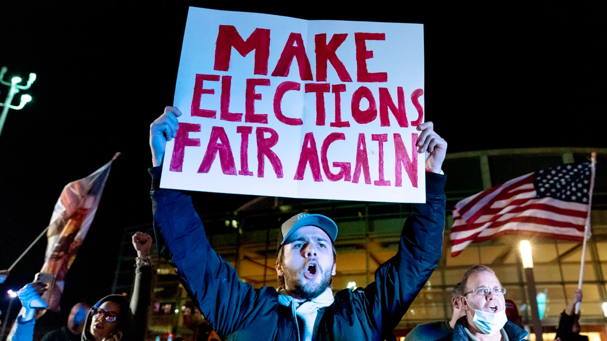 Trump supporter Jake Contos chants during a protest against the election results outside the central counting board at the tcf Center in Detroit, Thursday, Nov. 5, 2020. (AP)
