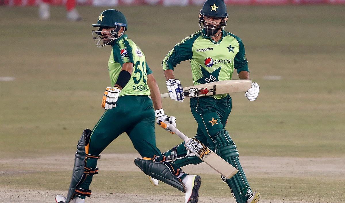 Pakistani batsmen Babar Azam and Mohammad Hafeez run between the wickets during Saturday’s match against Zimbabwe in Rawalpindi. (AP)