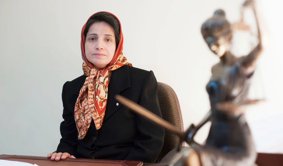 Rights lawyer Nasrin Sotoudeh is seen sitting in her office in Tehran. (AP/File)