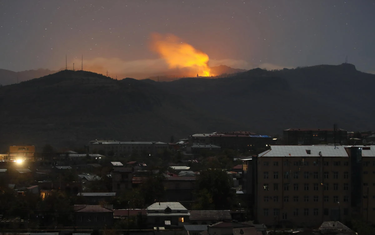 Bursts of explosions, smoke and flame are seen during fighting between Armenian and Azerbaijan’s forces near Shusha, called Shushi by Armenians on Saturday, Nov. 7, 2020. (AP)