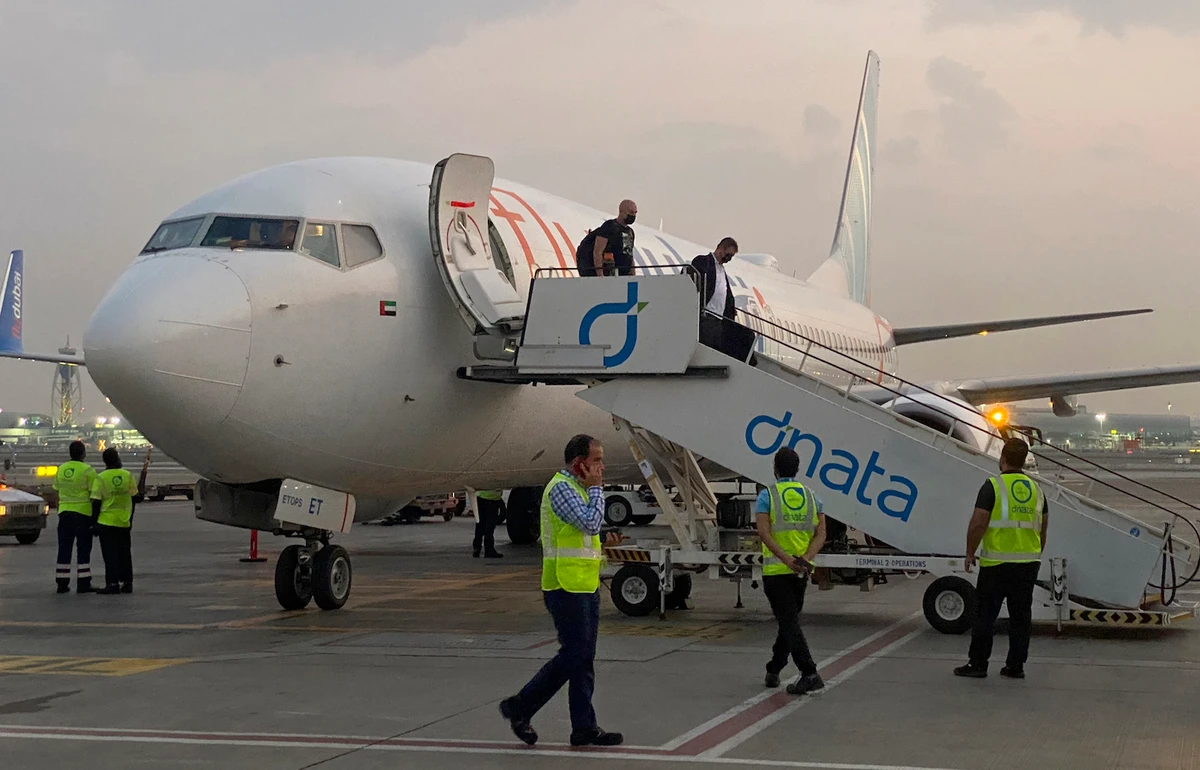 Israeli tourists leave a flydubai plane which departed from Ben-Gurion International Airport in Tel Aviv and landed in Dubai, United Arab Emirates, Sunday, Nov. 8, 2020. (AP)