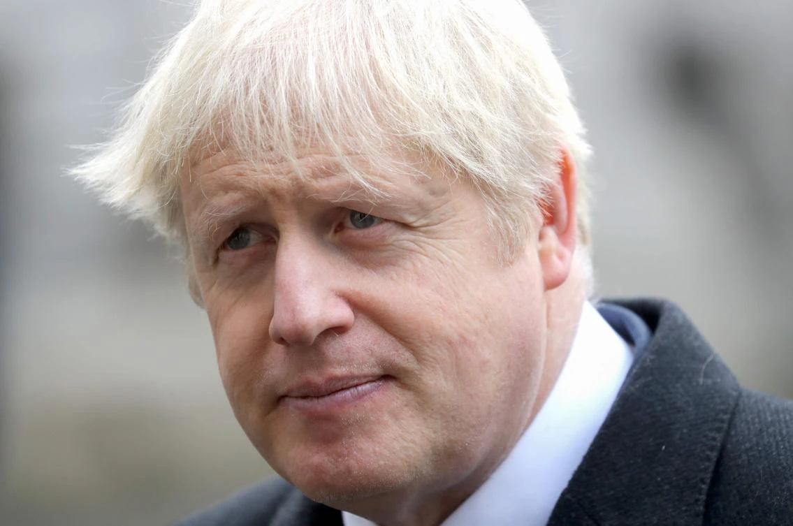 Britain's Prime Minister Boris Johnson meets veterans at the Remembrance Sunday ceremony at the Cenotaph on Whitehall in central London, on November 8, 2020. (AFP)