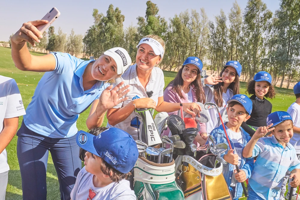 Camilla Lennarth and Amy Boulden coaching Saudi kids at a golf clinic in 2019. Coverage of this week’s $1 million Aramco Saudi Ladies International and the Saudi Ladies Team International will also be broadcast to 350 million households in 60 countries. (Supplied)