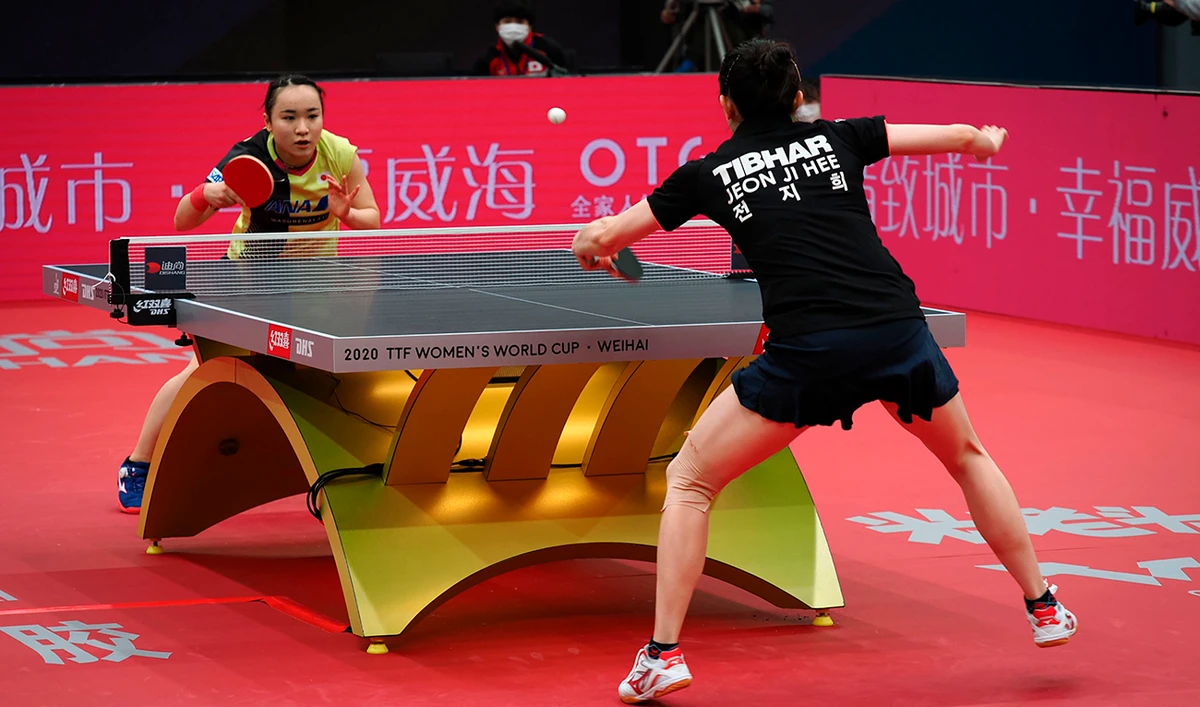 Mima Ito (L) of Japan competes against Jeon Ji-hee of South Korea at the Women’s World Cup table tennis competition in Weihai, in eastern China's Shandong province on November 9, 2020. (AFP)