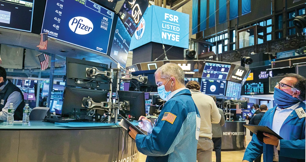 Wall Street’s main indexes hit record highs on Monday as the first successful data from a COVID-19 vaccine trial spurred hopes of the economy recovering quickly from a year of pandemic-driven crisis. (AP)