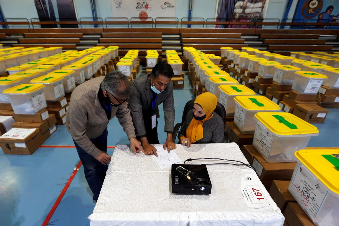 Jordanian election officials check ballot boxes for the parliamentary elections amid fears over rising number of the coronavirus diseases in Amman on Nov. 8, 2020. (Reuters)