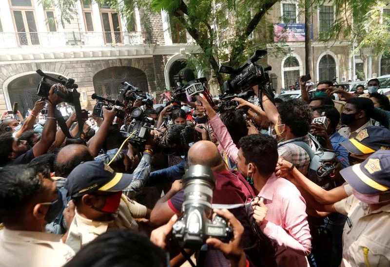 Media surrounds Bollywood actor Rhea Chakraborty as she arrives at Narcotics Control Bureau (NCB), following the death of her boyfriend and actor Sushant Singh Rajput, Mumbai, India, Sept. 6, 2020. (Reuters)