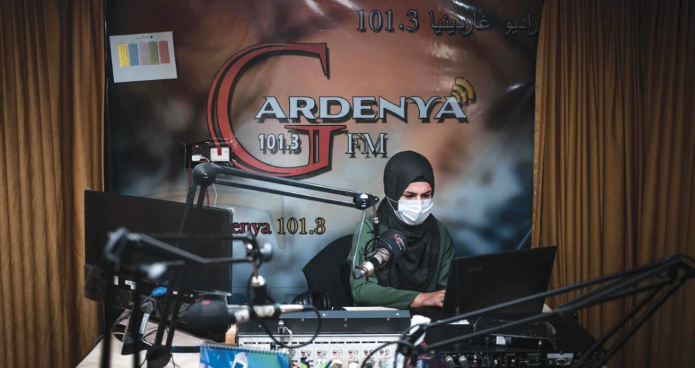 Gardenya FM radio journalist Sherin Mohammad records a program at the station’s studio at the Arbat refugee camp, 20 km east of Sulaimaniyah, Iraq’s autonomous Kurdistan region’s second-biggest city. (AFP)