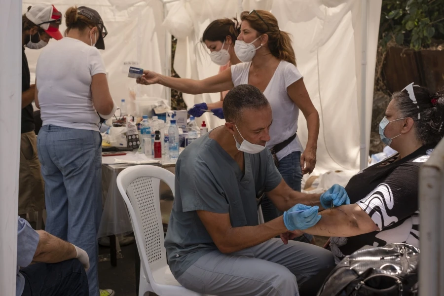 Volunteers from across Lebanon have flocked to support Basecamp, an initiative offering everything from food deliveries to garbage collection, from home repairs to mental health support. (Supplied)