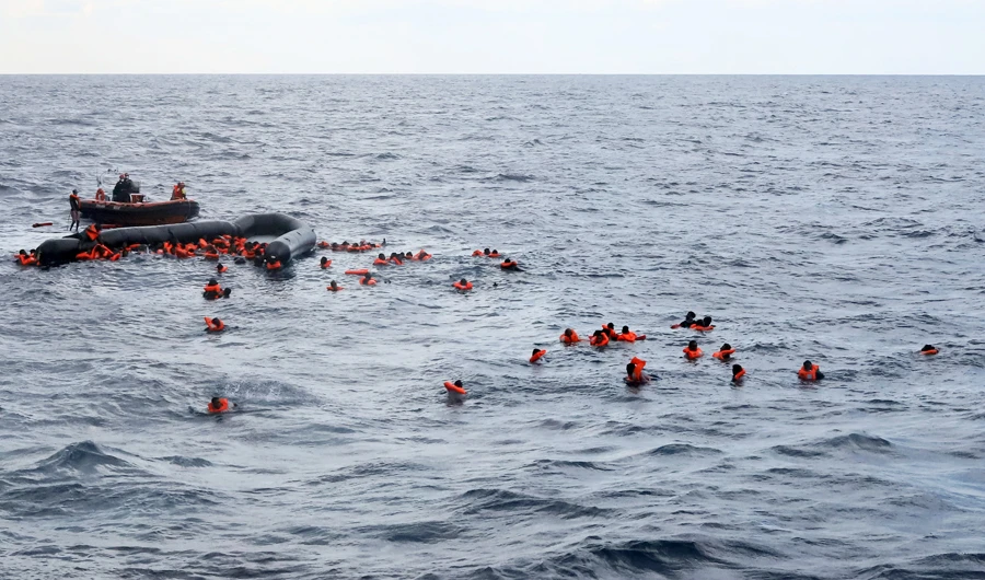 Refugees and migrants are rescued by members of the Spanish NGO Proactiva Open Arms, after leaving Libya trying to reach European soil aboard an overcrowded rubber boat in the Mediterranean sea, Wednesday, Nov. 11, 2020. (AP)