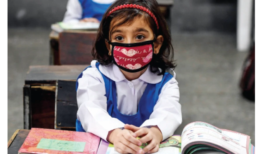 Children attend a class at a school in Islamabad amid concern over the spread of the COVID-19 disease. (File/AFP)