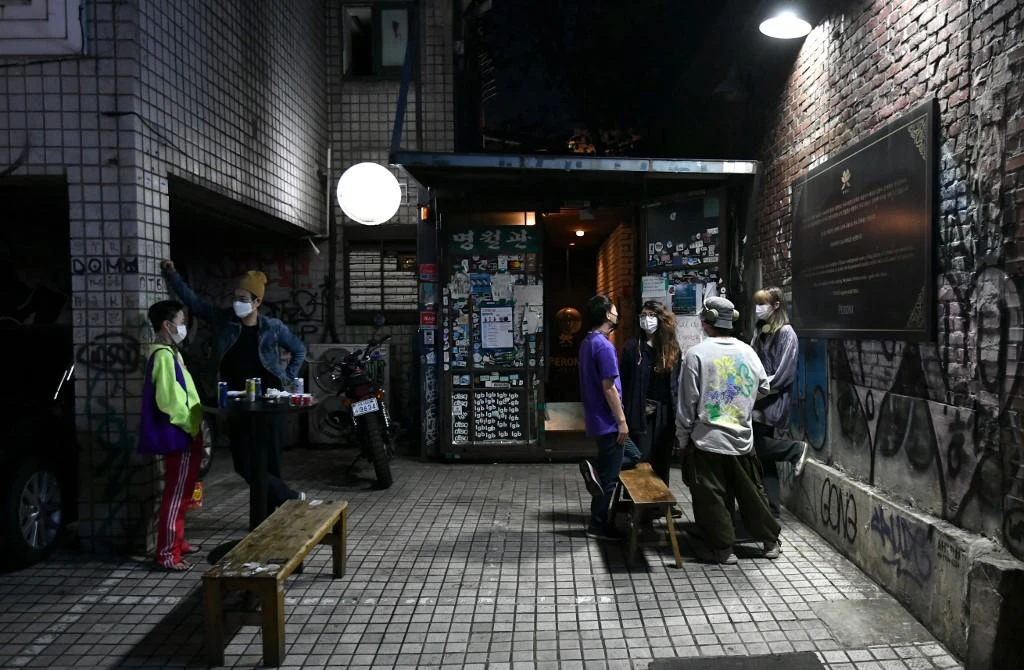 This picture taken on September 26, 2020 shows guests standing in front of the underground music club MWG. (File/AFP)