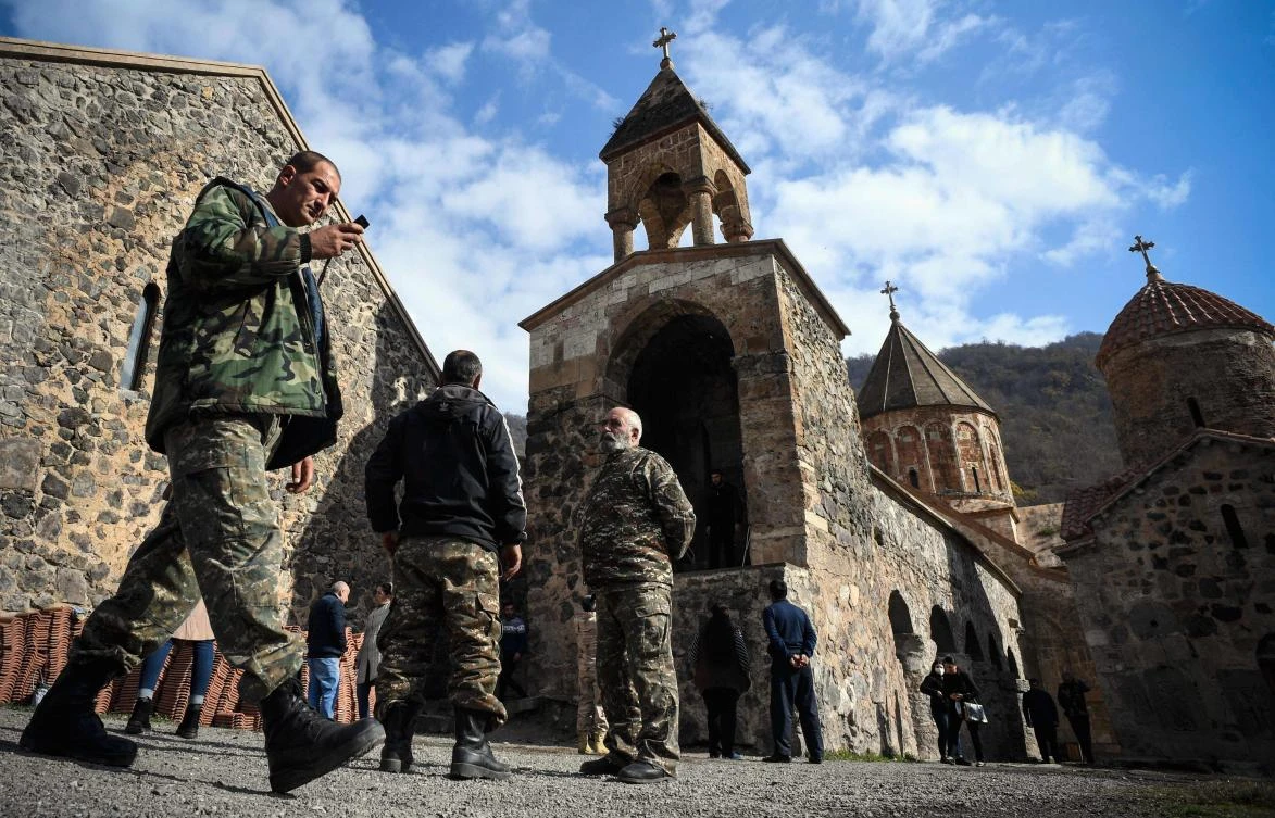 Armenians soldiers visit a last time the 12th-13th century Orthodox Dadivank Monastery on the outskirts of Kalbajar on November 12, 2020, during the military conflict between Armenia and Azerbaijan over the breakaway region of Nagorno-Karabakh. (AFP)