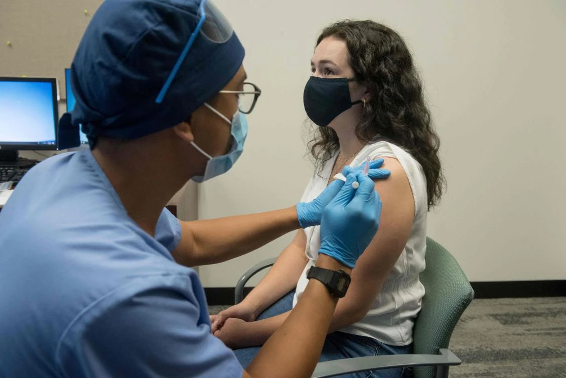 In this file photo taken on August 5, 2020, in this image courtesy of the Henry Ford Health System, volunteers are given the Moderna mRNA-1273 Coronavirus Efficacy (COVE), in Detroit, Michigan. US biotech firm Moderna on November 16, 2020 announced its experimental vaccine against Covid-19 was 94.5 percent effective, marking a second major breakthrough in the vaccine hunt. (AFP)