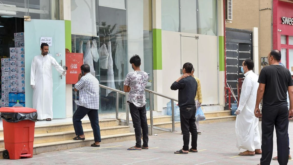 Customers observe social distancing outside a supermarket in Riyadh to reduce the risk of infection from the novel coronavirus. (AFP)