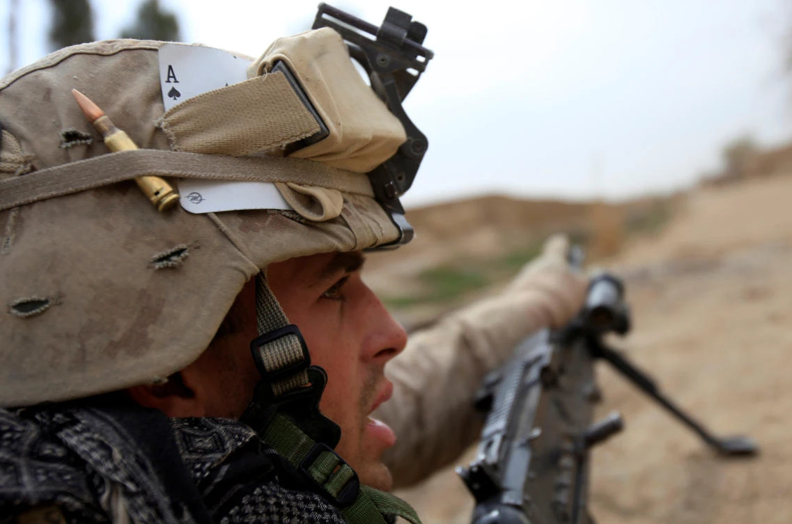 A U.S. Marine from Bravo Company of the 1st Battalion, 6th Marines gestures during an operation in Marjah, Helmand province February 21, 2010. NATO forces are facing strong resistance eight days into a major offensive in southern Afghanistan as Taliban fighters dig in to fight to the death. (Reuters)