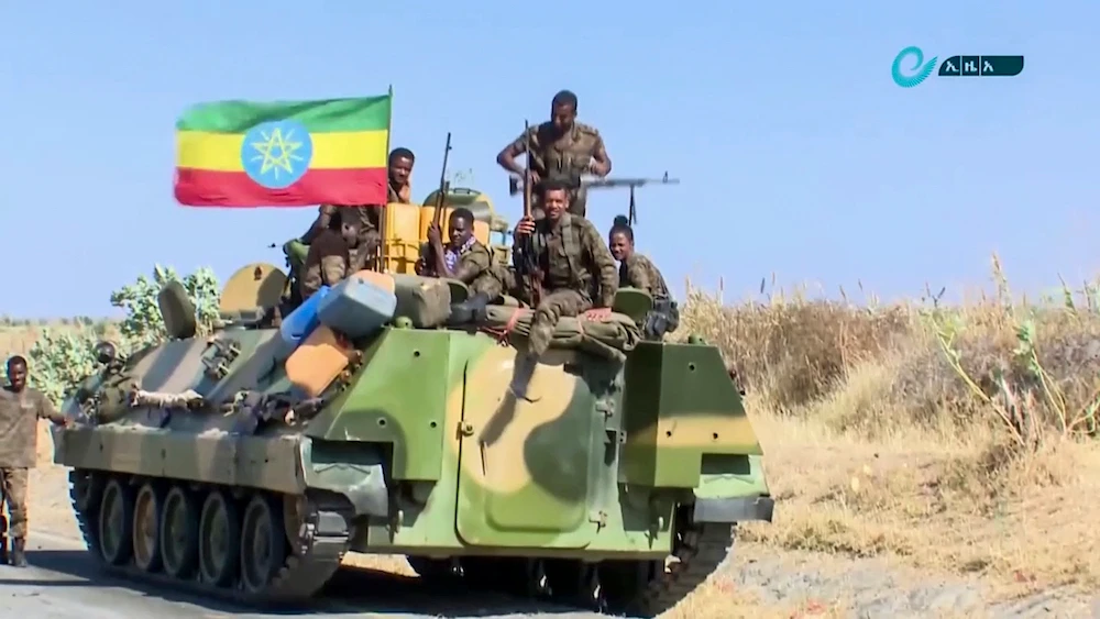 Ethiopian military sitting on an armored personnel carrier in an area near the border of the Tigray and Amhara regions of Ethiopia. (Ethiopian News Agency via AP)