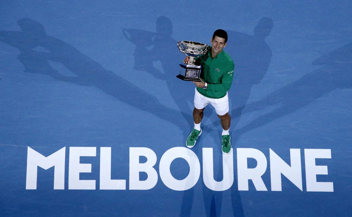 Serbia’s Novak Djokovic celebrates after defeating Austria’s Dominic Thiem in the men’s singles final of the Australian Open tennis championship in Melbourne on Feb. 3, 2020. (AP)