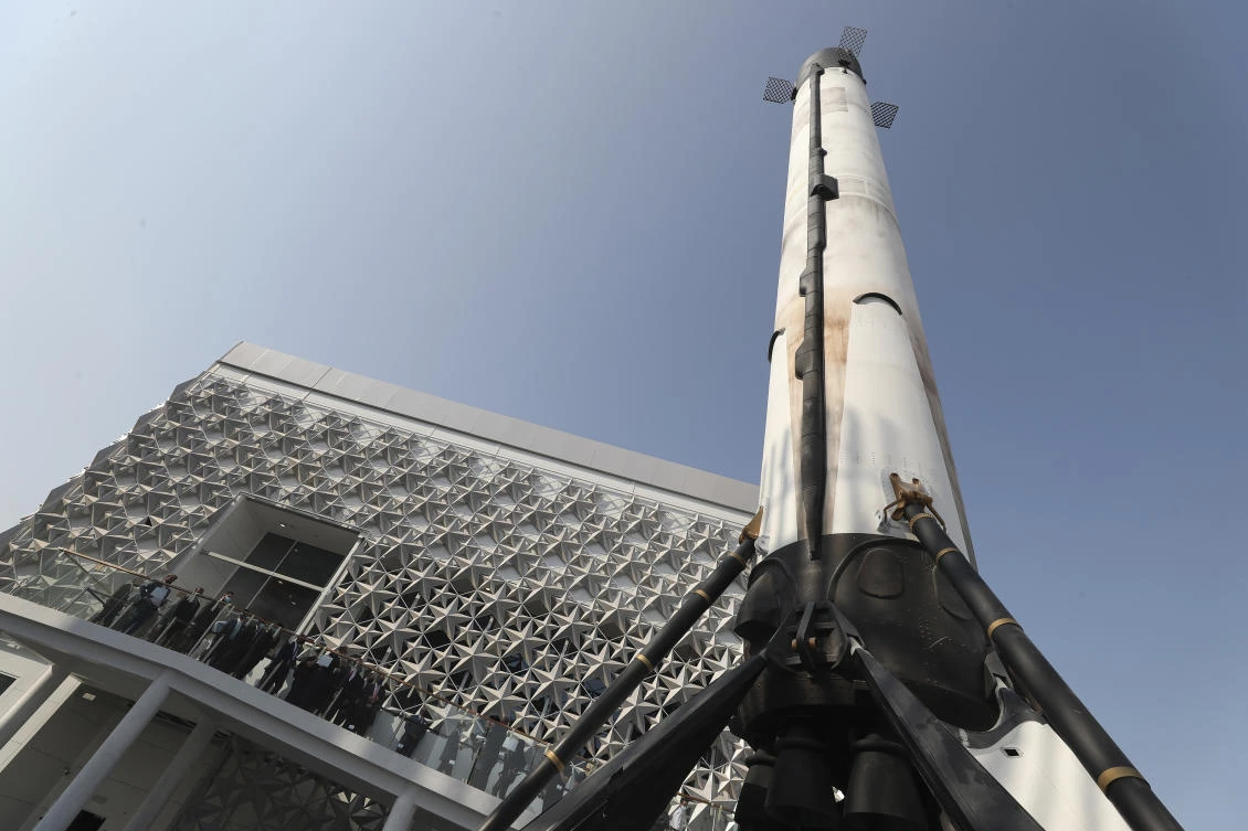 US ambassador John Rakolta and guests visit a replica of the SpaceX Falcon 9 during the handover ceremony of the US Pavilion at the Dubai Expo 2020 on Nov. 18, 2020. (AP)