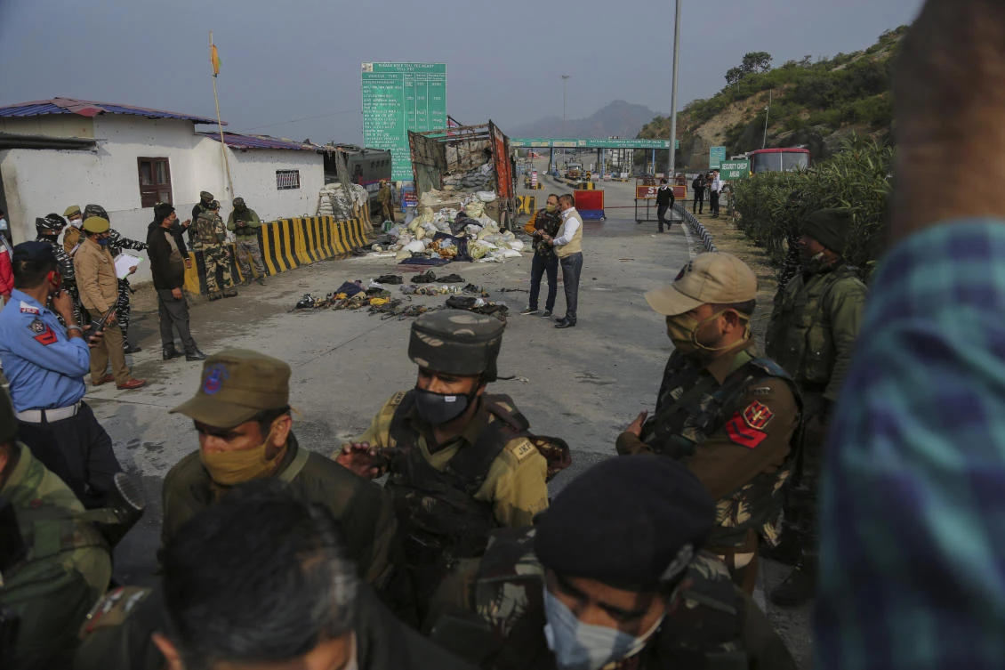 Indian security forces inspect the site after a gunfight between suspected rebels and Indian security forces at a checkpoint in Nagrota, outskirts of Jammu on Nov.19, 2020. (AP)