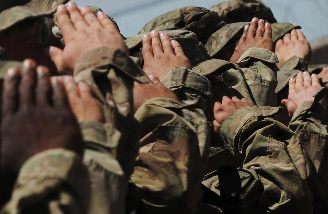 In this file photo US soldiers of the 10th Mountain Division US Army salute as the US national anthem is played during the Army Safety Excellence Award ceremony inside the Forward Operating Base(FOB) Arian at the Ghazni province on May 20, 2013. (AFP)