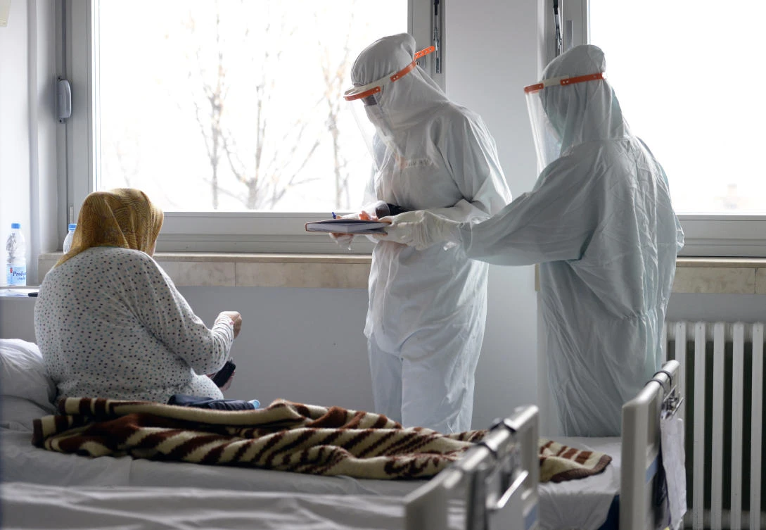 A doctor and nurse take care of patients with COVID-19 at a former military hospital in the capital Sarajevo, Bosnia, Thursday, Nov. 19, 2020. (AP)