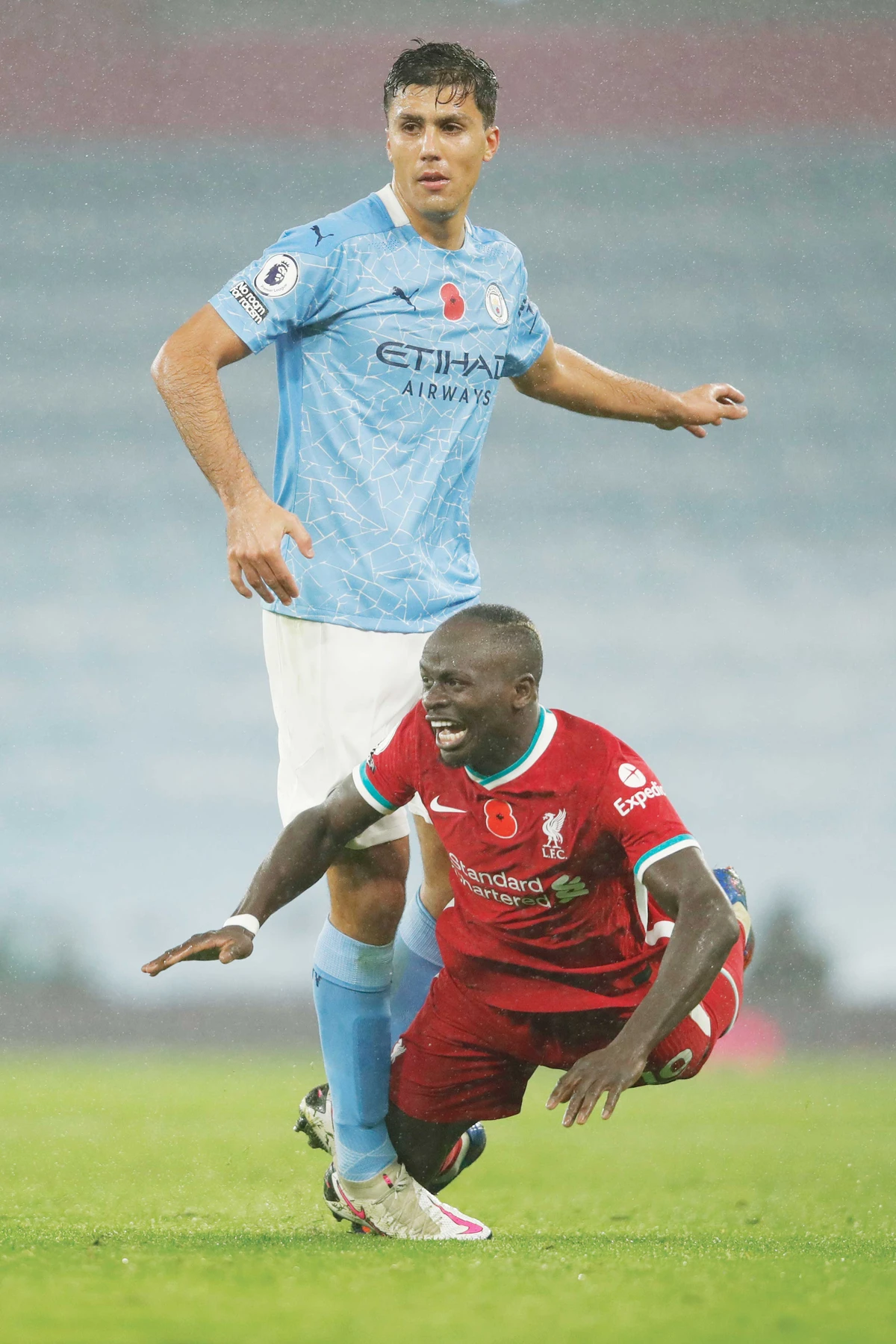 Liverpool’s striker Sadio Mane competes with Manchester City’s midfielder Rodri during a recent Premier League match. (AFP)