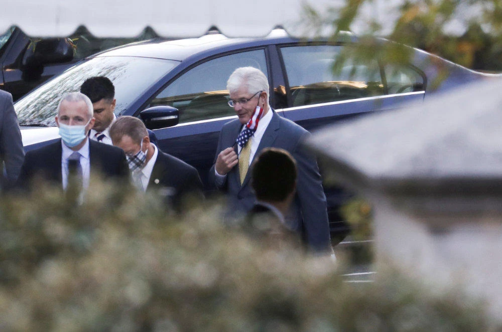 Michigan State Senate Majority Leader Mike Shirkey adjusts his protective face mask as he arrives to meet with US President Donald Trump at the White House in Washington on Nov. 20, 2020. (EUTERS/Leah Millis)