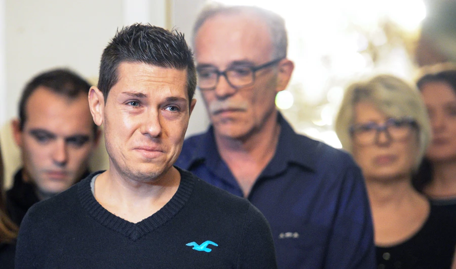 In this file photo taken on November 2, 2017 Jonathann Daval (L), the husband of slain Alexia Daval, arrives with his wife's father Jean-Pierre Fouillot (C) and mother Isabelle Fouillot (R), to hold a press conference at the Town Hall in Gray, eastern France. (AFP)