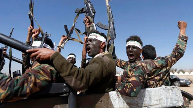 Houthi militants chant slogans as they ride a military vehicle during a gathering in the capital Sanaa. (AFP/File)