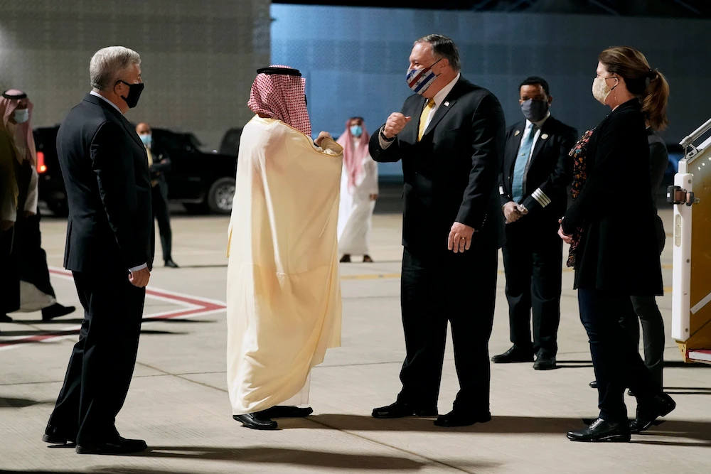 Foreign Minister Faisal bin Farhan and US Ambassador to Saudi Arabia's John Abizaid greet Secretary of State Mike Pompeo and his wife Susan as they arrive at Neom Bay Airport in Saudi Arabia. (AP)
