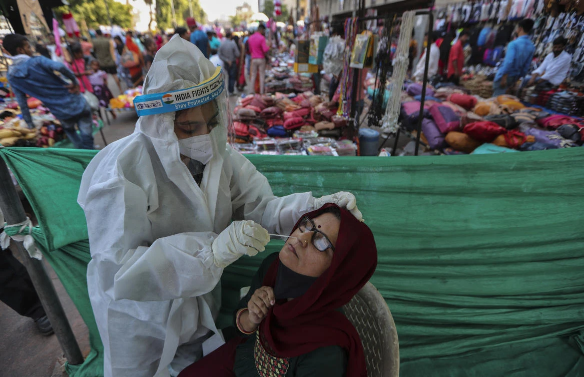 New daily coronavirus cases in India have come in at fewer than 50,000 for more than two weeks. (AP)