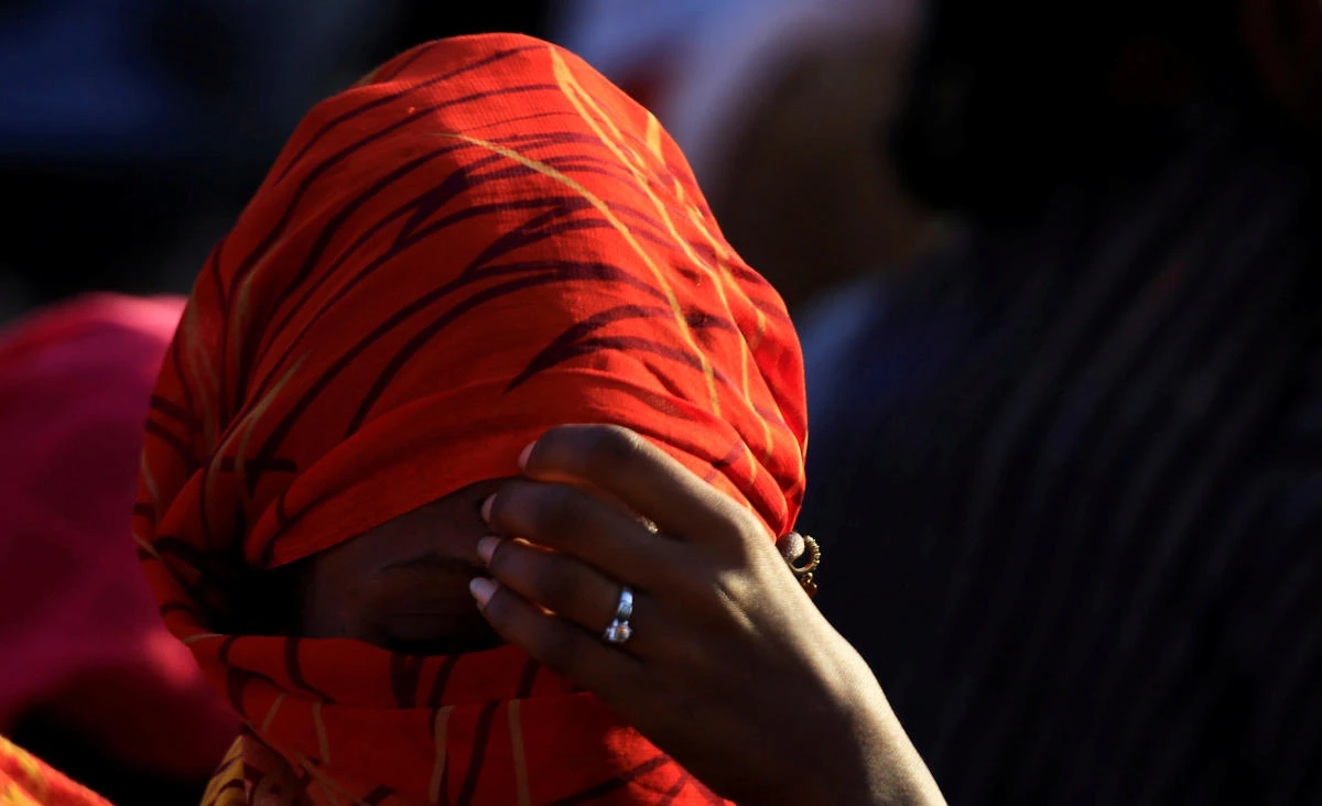 An Ethiopian woman who fled the ongoing fighting in Tigray region, sits in Hamdayet village near the Sudan-Ethiopia border, eastern Kassala state, Sudan November 22, 2020. (Reuters)