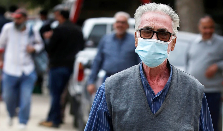 A man wearing a protective face mask amid the coronavirus disease (COVID-19) pandemic walks in Cairo, Egypt November 23, 2020. (REUTERS)