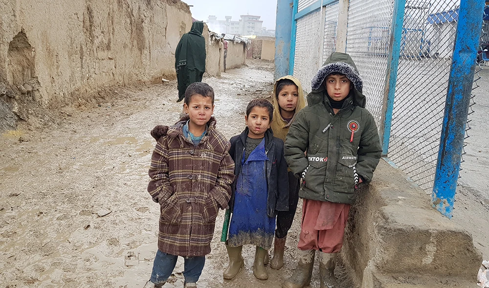 Children outside their homes at the Charahi Qambar camp, which houses thousands of war-displaced Afghans. (AN photo by Sayed Salahuddin)