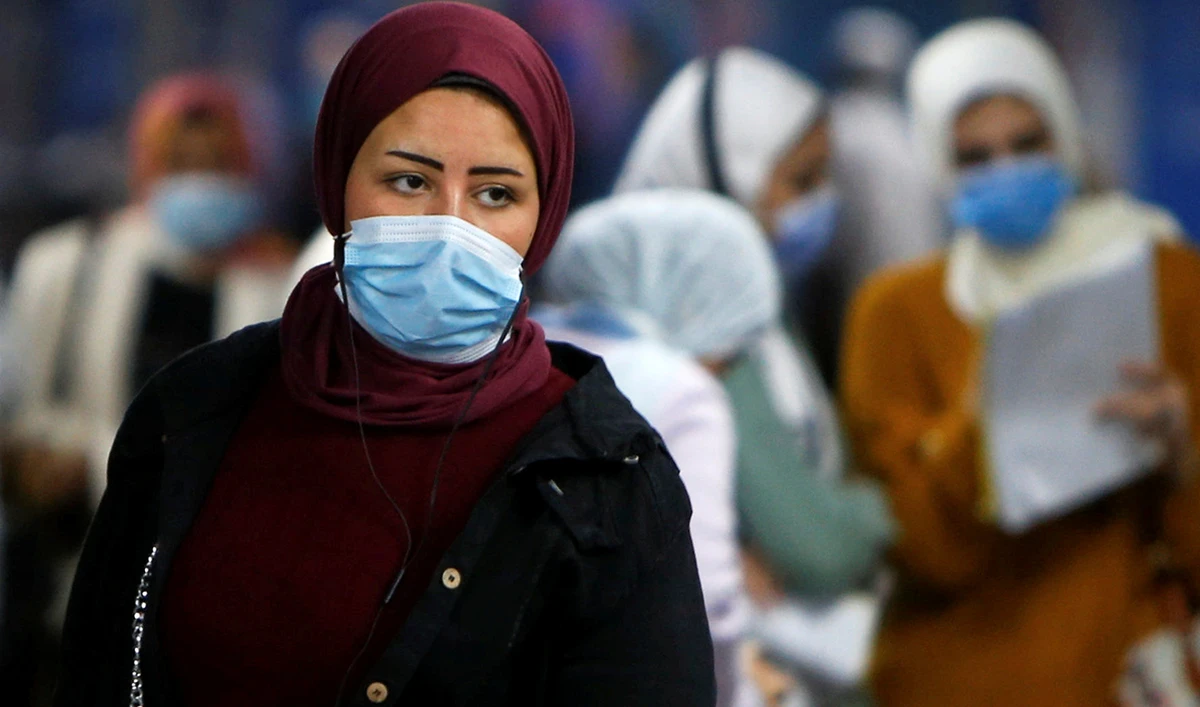 A woman wearing a protective face mask walks at the underground Al Shohadaa "Martyrs" metro station in Cairo, Egypt. (Reuters)