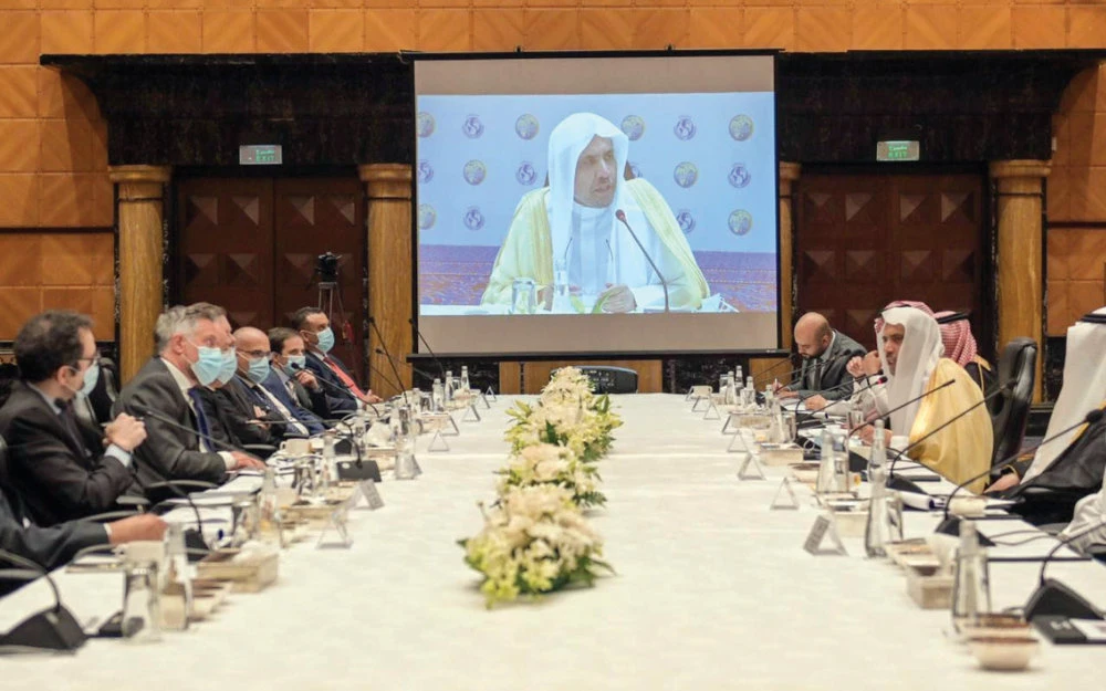 MWL Secretary-General Mohammed bin Abdulkarim Al-Issa (shown on screen) presides over a meeting on Thursday. (SPA)