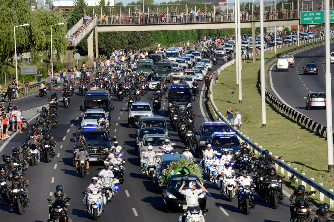 Argentinians pay their respects as Diego Maradona’s cortege passes along highway 25 de Mayo, Buenos Aires, Argentina, November 26, 2020. (Reuters)