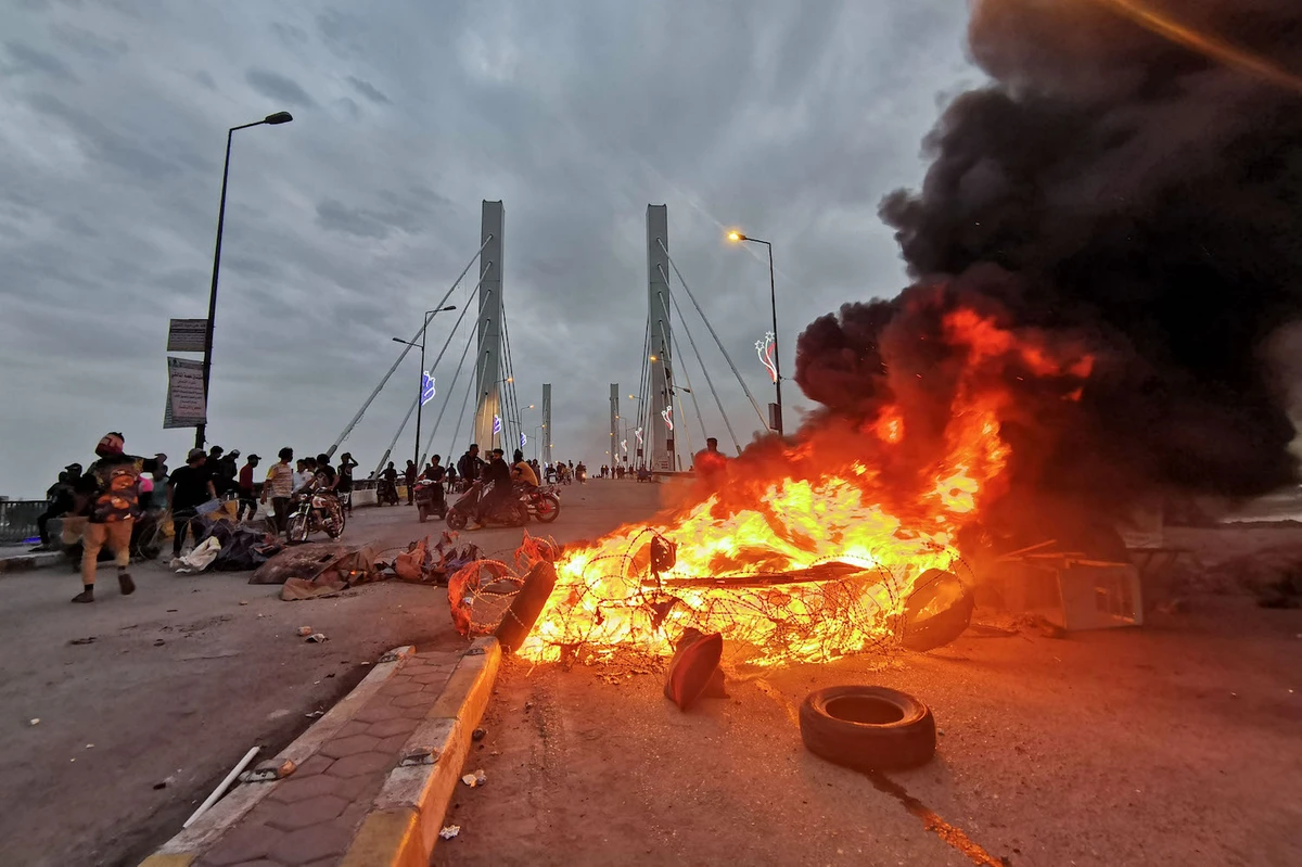 Four dead as rival protesters clash in southern Iraq