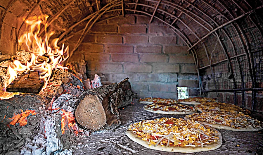 Inside a wood-fired oven at the Jemapoh Pizza Kayu Api restaurant. (AFP)