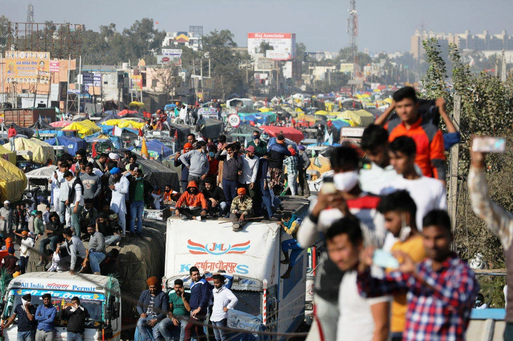 Farmers are seen with their trucks parked on a national highway as they protest against the newly passed farm bills at Singhu border near Delhi, India, on Nov. 27, 2020. (REUTERS/Anushree Fadnavis)
