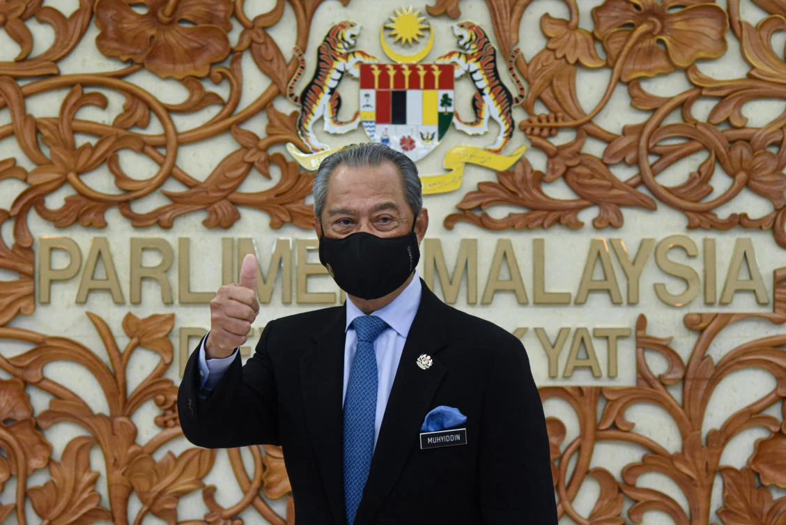 Malaysia's Prime Minister Muhyiddin Yassin poses for a picture at the parliament, in Kuala Lumpur, Malaysia November 26, 2020. (Reuters)