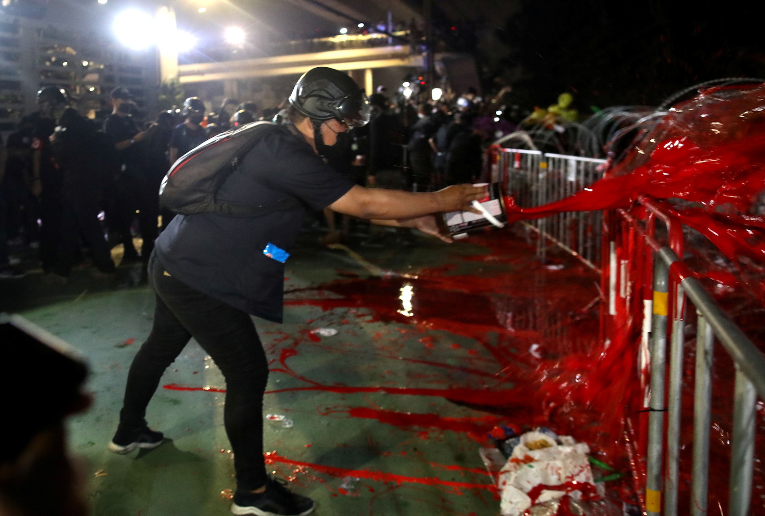A protester throws red paint at 11th Infantry Regiment during a pro-democracy rally in Bangkok, Thailand. Nov. 29, 2020(Reuters)