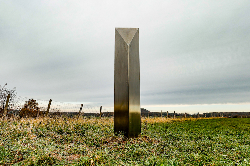 A picture taken on December 10, 2020 shows a mysterious metal monolith, similar to others appearing in Europe and USA, which was discovered in the nature reserve area Tiendeberg, in Riemst. (AFP)