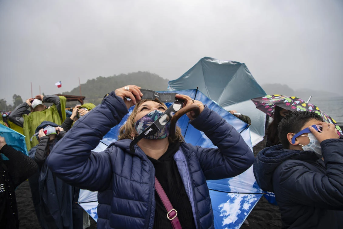 The total solar eclipse as seen from from Pucon, southern Chile, on December 14, 2020. The hopes of thousands of tourists and residents in Chile's south saw their hopes of watching a total eclipse of the sun shrink as heavy rain fell on Monday just hours before the expected event.Martin BERNETTI / AFP